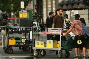 Crew members get ready to film a scene. 