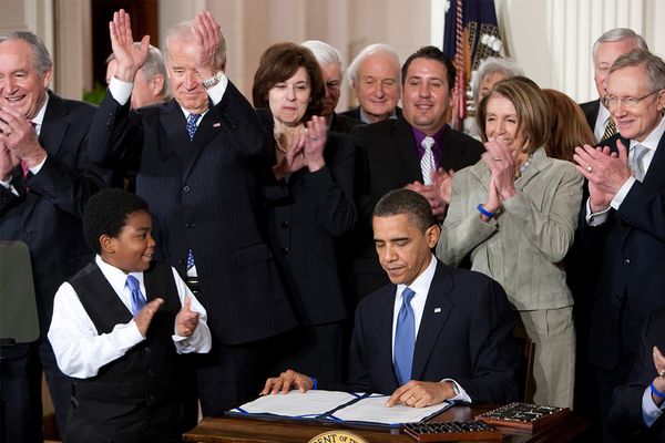 President Obama signs the Affordable Care Act.