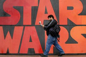 A man walks past a poster promoting the 'Star Wars' final episode in Santiago, Chile, on May 18, 2005. It's pretty much a heavyweight across all film genres.