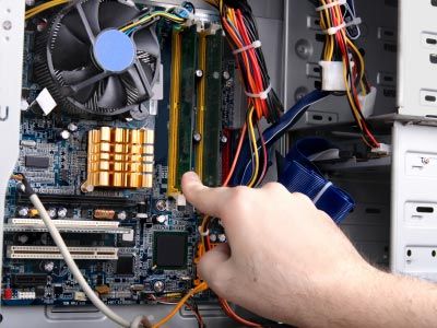 After safely opening up your desktop to reveal its insides, adding new RAM is a simple process.