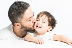 Man kissing baby