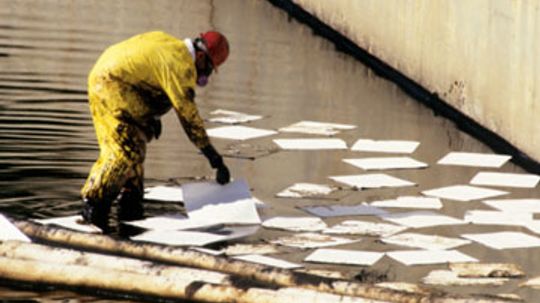 How are adsorbents used for environmental cleanup?