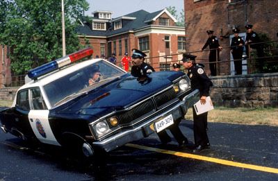 Bubba Smith lifts car