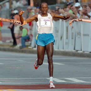 Runner Crossing Finish Line by Jupiterimages