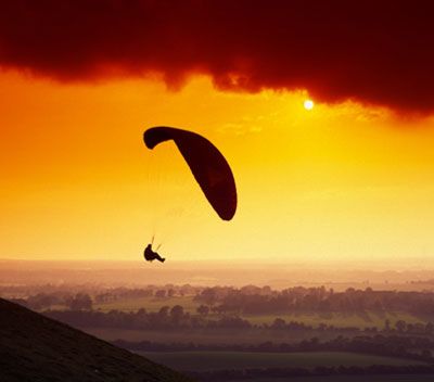 Flying high in extreme sports at sunset outdoors.