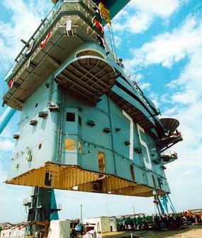 Lowering superlifts into positionon the USS Harry S. Truman