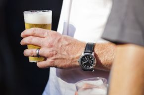 Man with watch and beer