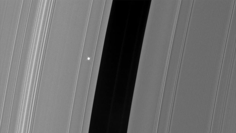 An image of Aldebaran — seen only as a tiny white dot — taken from the Cassini space probe.