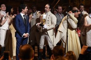 Music director Alex Lacamoire and &quot;Hamilton&quot; actor/composer Lin-Manuel Miranda celebrate onstage after winning a Grammy award in 2016.