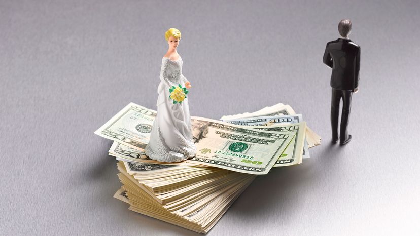 bride figure on top of pile of dollar bills