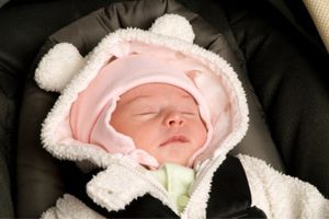 infant girl in car seat