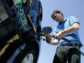 Garvin Cui fuels up his natural gas vehicle at a Clean Energy station in San Francisco, Calif., on Sept. 4, 2008.