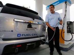 Alex Keros, a General Motors senior engineer, demonstrates how to fill up a General Motors Chevrolet Equinox fuel cell-electric SUV with hydrogen at California's first hydrogen refueling station.