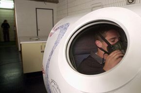Athlete Brent Sherwin is treated inside a hyperbaric during training at Belmore Sports Ground, Sydney, Australia, in 2001. Portable hyperbaric chambers or gamow bags can be used to treat altitude sickness.