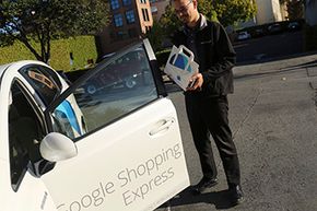 A Google Express courier picks up an order to deliver to a customer.