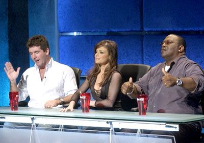 American Idol judges evaluate singers.