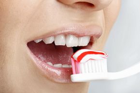 How did people clean their teeth before toohtbrushes?