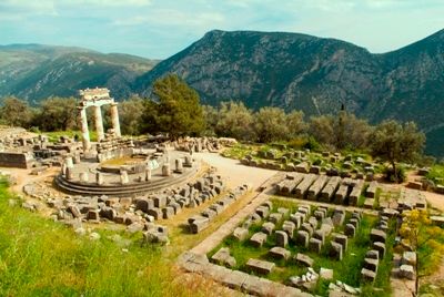 ruins of the tholos temple in the sanctuary of Athena Pronaia