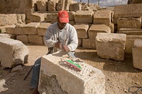 A modern stonemason continues preservation efforts on the 2,000-year-old Roman city of Jerash, Jordan, using some techniques that a stonemason from that time period might have recognized.
