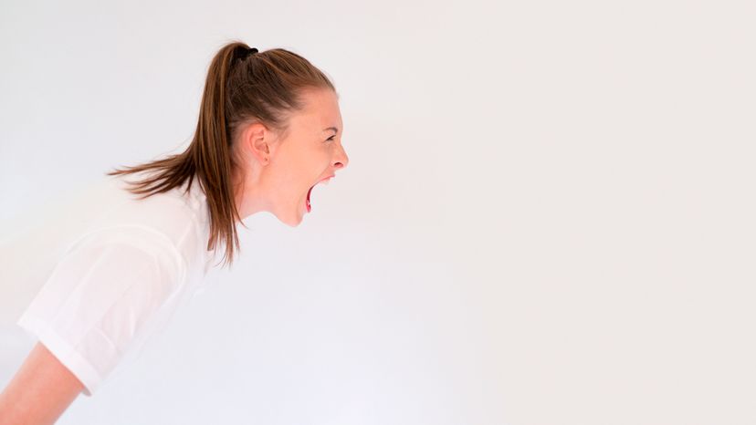 A young woman screaming.