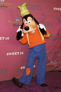 The whole standing-on-two-legs thing makes Goofy an anthropomorphized dog. The pants and suspenders don't help either.