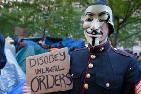 An Occupy Wall Street protester in Zuccotti Park on Oct. 30, 2011, the day after a nor'easter storm blanketed the area in snow.