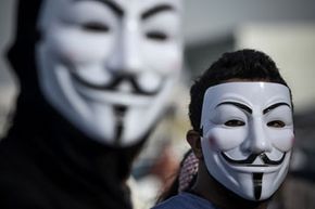 Protesters in Bahrain wearing Guy Fawkes masks used by the Anonymous movement.