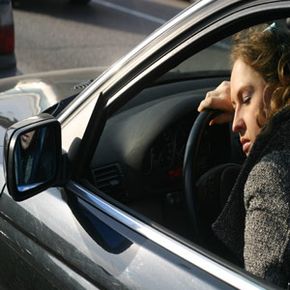 Driver asleep at steering wheel. 