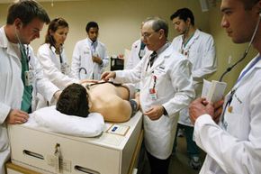 Medical students at the University of Miami work with Harvey, the cardiopulmonary patient simulator.