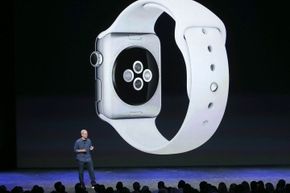 The slide above Apple CEO Tim Cook shows the Digital Crown on the side of the Watch and the buttons and the back of the device.