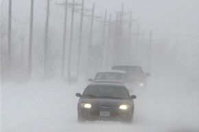 Vehicles travel in poor visibility near Mead, Neb.