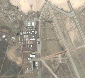 A satellite view of Area 51, with open desert, roads, and buildings in view.