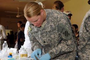 Spc. Samantha Short, a pharmacy technician assigned to 1st Advise and Assist Brigade, 3rd Infantry Division, United States Division - Center, fills a prescription during a combined medical engagement at a clinic in Qarghuli, a village south of Baghdad.