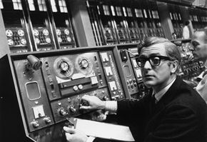 Actor Michael Caine plays the cockney spy Harry Palmer in the 1967 movie "Billion Dollar Brain." A Honeywell computer, like one that the UCLA team used to connect to ARPANET, is the basis of a huge film set at Pinewood Studios.”border=