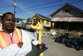 As if Hurricane Katrina didn't cause enough problems, the storm also disturbed asbestos present in older homes. Specially trained crews, like the one of which Anthony Neal (above) is a member, were called in to help deal with asbestos removal. See more pictures of natural disasters.