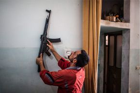 August 2012: A Sturmgewehr 44 hangs on the wall of a home in Tal Rifaat, Syria. According to some reports, Syrian rebels found thousands of the World War II-era weapons in a large warehouse.