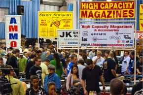 Signs at a 2011 Florida gun show advertise high-capacity magazines and accessories.