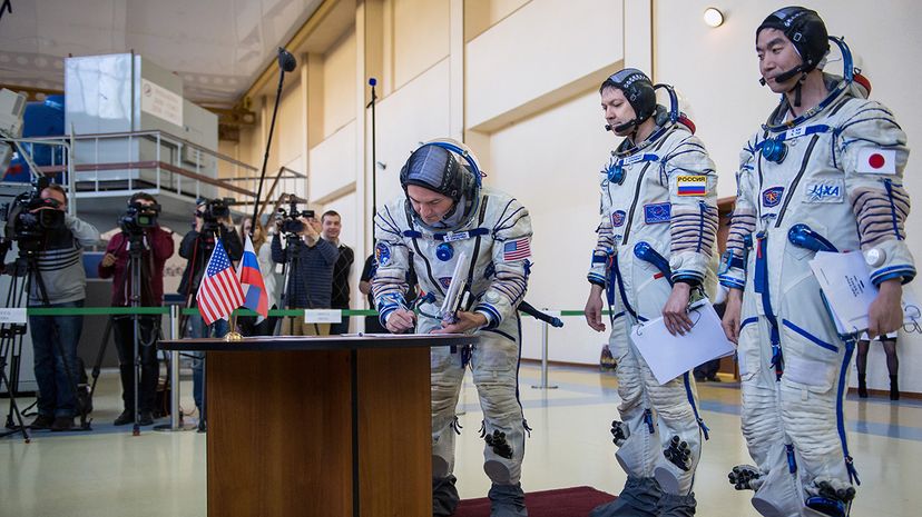 astronauts training to use bathroom