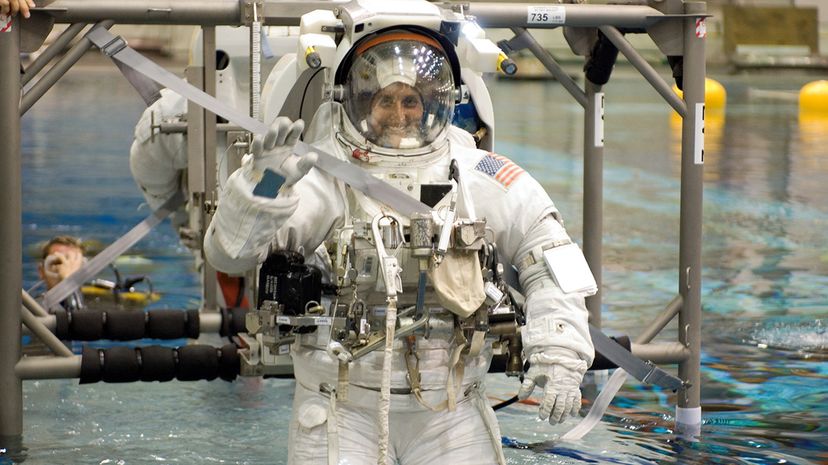 astronauts training to use bathroom