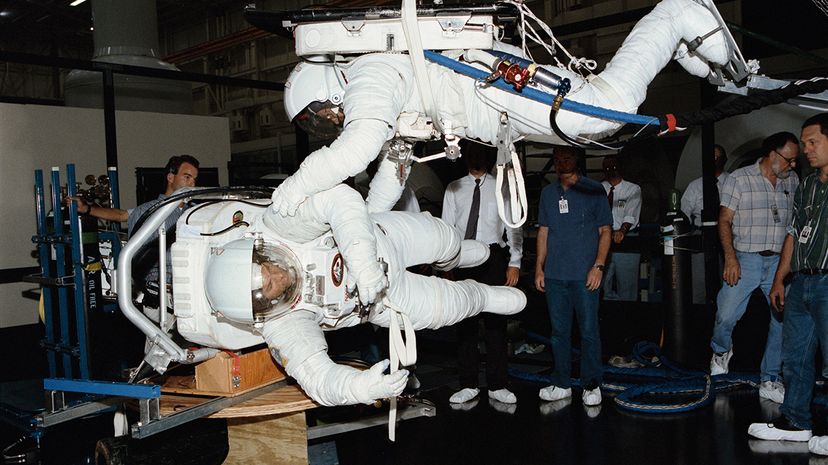 astronauts training to use bathroom