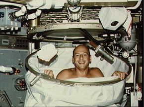 Astronaut Charles Conrad Jr., Skylab 2 commander, smiles for the camera after a hot shower in the shower facility.