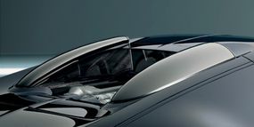 The Bugatti Veyron's tail wing creates downforce at high speeds. Engine and air snorkels