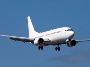 Commercial airplane flying for air transportation.