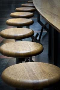 Bar stools around bar.