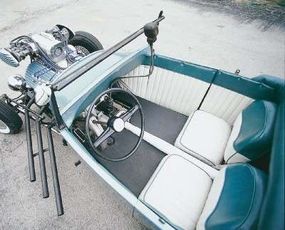 The interior of the Burk roadster was outfitted with a pressboard door and dash panels covered with pleated vinyl.