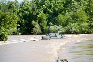 Car in flooded river