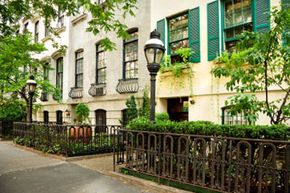 White townhouses with garden level