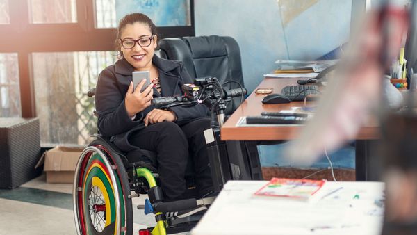 woman in wheelchair with phone