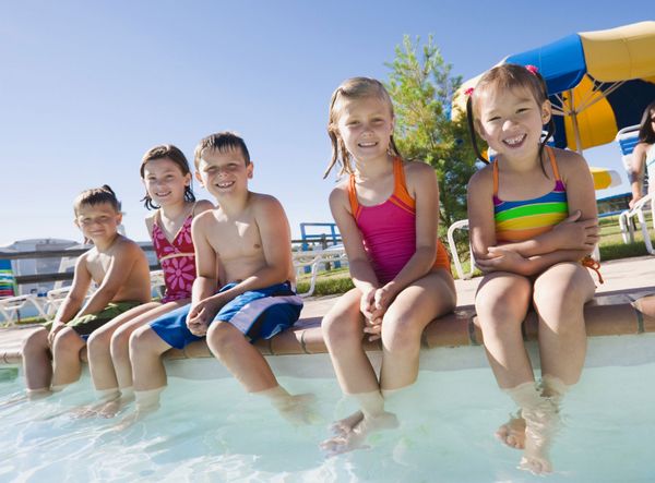 Smiling girls enjoying childhood summer.