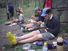Appalachian Trail hikers prepare and eat dinner in the Great Smokey Mountains.